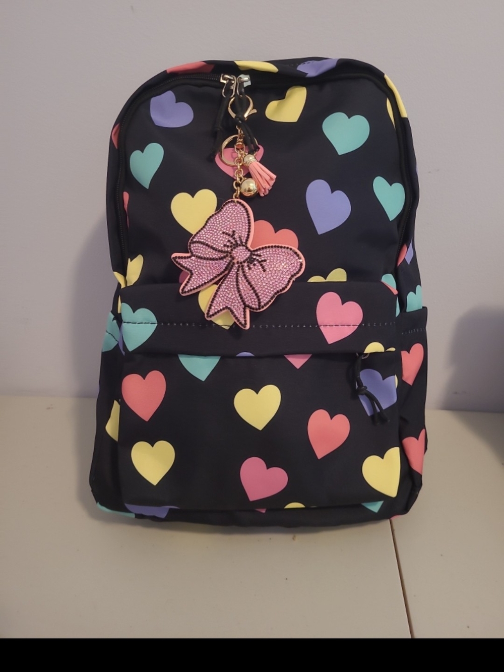Black Backpack with Multicolor Heart Print and Pink Bow Charm